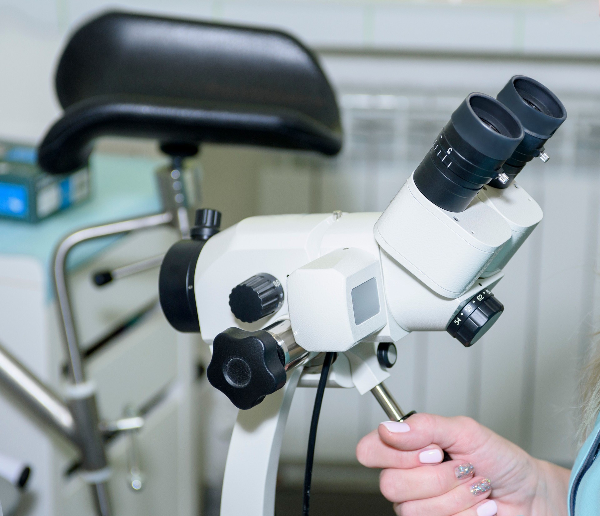 The gynecologist looks through a microscope. Medical equipment. Close-up of a colposcope.